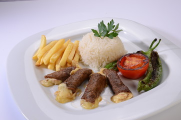 rolled beef steaks filled with cheese with salad and french fries