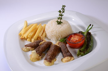 rolled beef steaks filled with cheese with salad and french fries