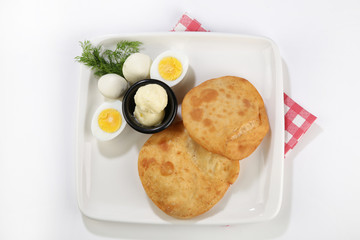 afried borek called turkish cuisine made with raw ground meat, onions, and spices served with eggs
