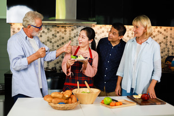Senior couple Man and woman cooking in kitchen happy mood
