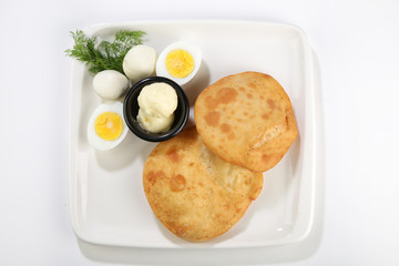 afried borek called turkish cuisine made with raw ground meat, onions, and spices served with eggs