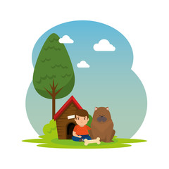 cute little boy with dog and wooden house in the landscape