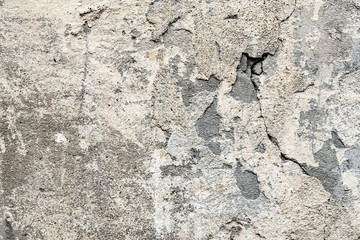 Fragment of the old wall with decaying and fallen off plaster