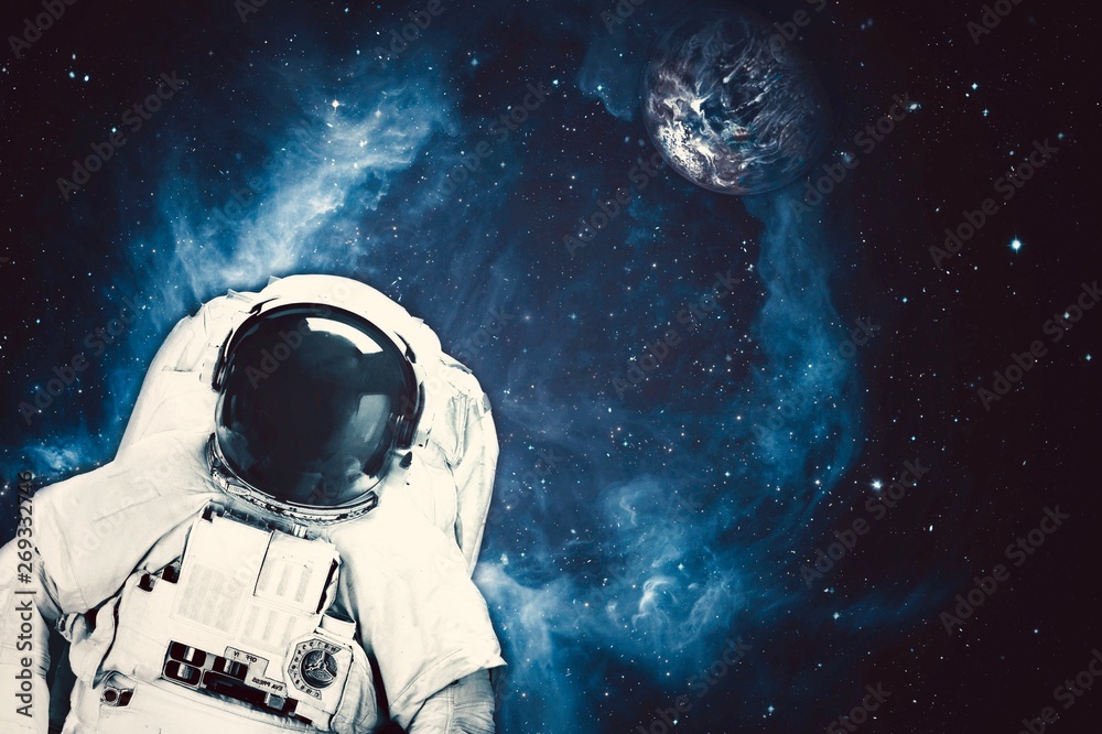 Wall mural astronaut in space with planet