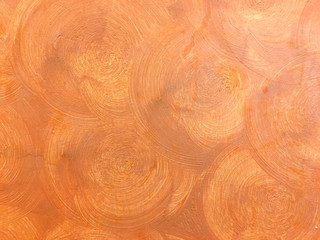 Abstract orange brick color circle plaster on the cement wall. Beautiful art interior building.