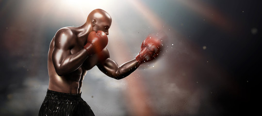 Strong boxer throwing a hook