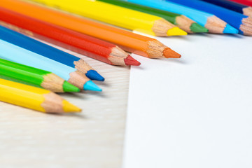 Set of colored pencils. Colors of rainbow. Colored pencils for drawing different colors on a white background.