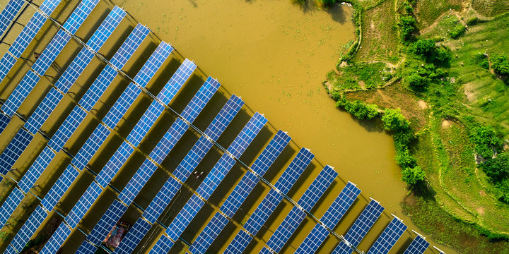 Aerial photography of solar photovoltaic panels built on the surface of the water