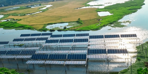 Aerial photography of solar photovoltaic panels built on the surface of the water