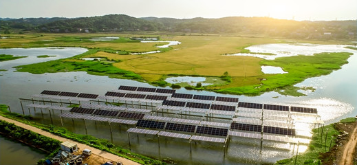 Aerial photography of solar photovoltaic panels built on the surface of the water