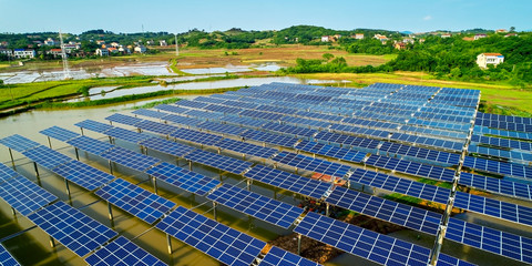 Aerial photography of solar photovoltaic panels built on the surface of the water