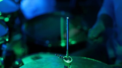 Close up of drum plate hi hat and a drummer playing on drums