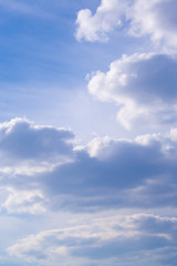 White clouds high in the sky at windy winter day background