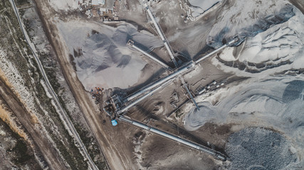 Aerial view of the granite - gravel pit. Equipment for processing and crushing stones