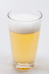 Glass of beer isolated on white
