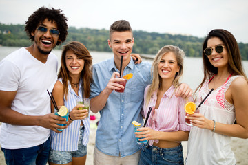 Group of friends having fun on the beach. Summer, fun, people, vacation concept.