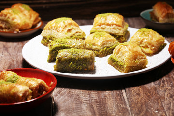 Middle eastern or arabic dishes. Turkish Dessert Baklava with pistachio on dishes