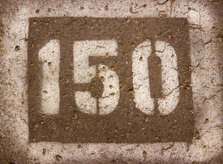 the numbers on the pavement 150