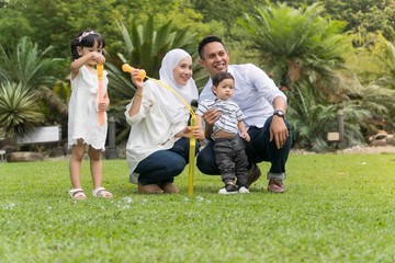 Fototapeta premium Malay family at recreational park having fun