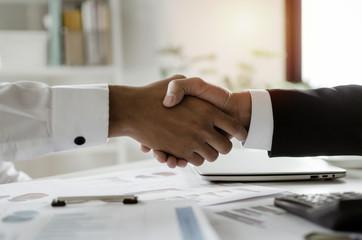 Deal. group of business people handshake after finishing up business meeting in meeting room at...