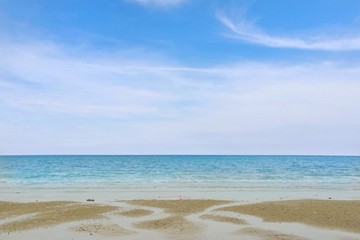 Soft wave of the sea on the sandy beach in the morning with blue sky at Rayong, Thailand, Many tourists visit here, View for seascape, Space for text in template