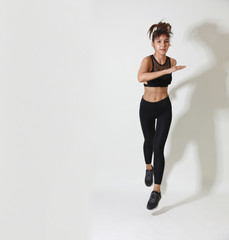 sporty and attractive woman do fitness exercise isolated on a white