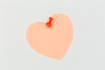 Note with a paper clip. Isolated on a white background
