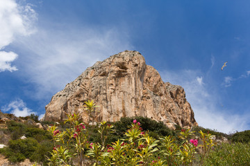 Calp Costa Blanca Spain view up to Penon de Ilfach the large rock from the walk around the bottom of the famous landmark