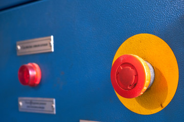 Red button for emergency shutdown of industrial equipment. signal red lamp