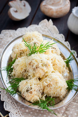 Salad with mushrooms in the form of balls in cheese, rafaello, selective focus