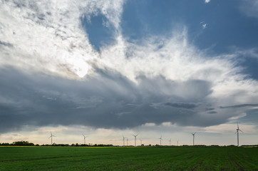 CLOUDS IN THE SKY - Stormy weather over green fields