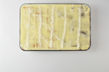 Homemade cake in a glass bowl isolated on white background