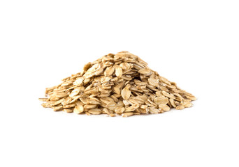 Side view of uncooked oat flakes pile. Oatmeal isolated on white