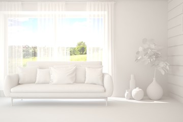 Mock up of stylish room in white color with sofa and green landscape in window. Scandinavian interior design. 3D illustration
