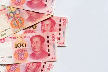 top view of 100 yuan chinese banknotes currency on white background