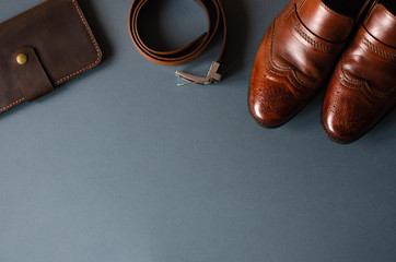 Flat lay with men's accessories on a gray stylish background.