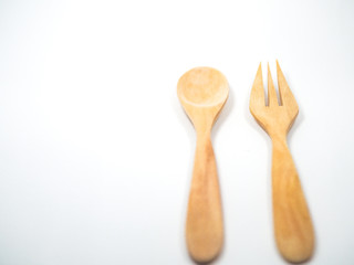 Wooden Spoon and fork on a white
