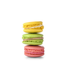 Tasty macarons on white background