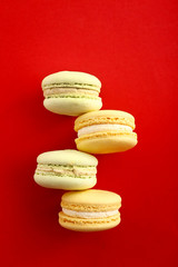 Tasty macarons on color background