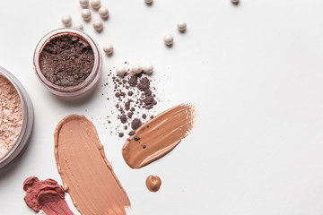 Different cosmetic products on light background