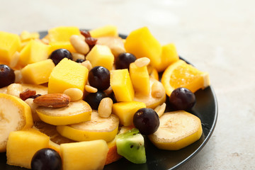 Tasty mango salad on plate, closeup