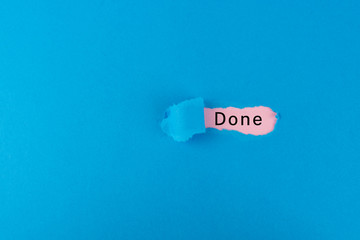 Torn paper with the word done underneath