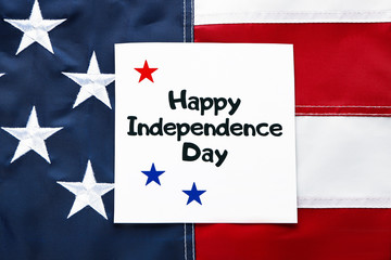 Card with text HAPPY INDEPENDENCE DAY on the USA flag