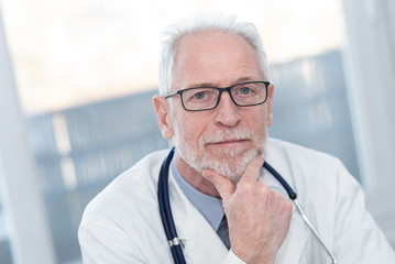 Portrait of male senior doctor