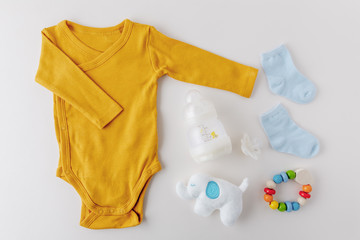 Baby goods on light pastel background
