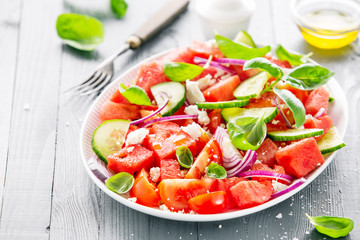 Summer salad with watermelon and salad leaves