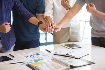 Business group or business partners discussing documents and ideas at meeting