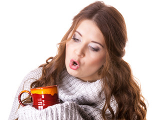 Woman holding red tea coffee mug