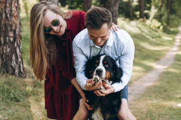 Portrait of a happy family with a dog