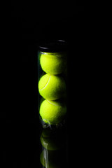 Tennis Ball isolated on black with dramatic lighting